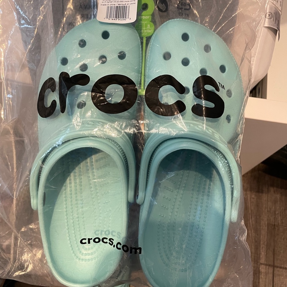 Brand new Crocs size 11. Color is Pure Water. Still in package never used.